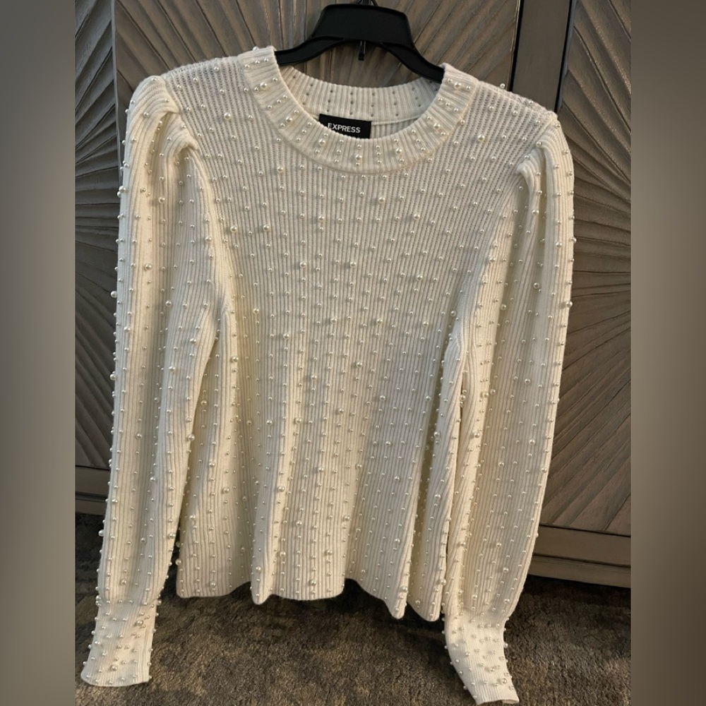 Beautiful cream sweater with hand beating all over size large never worn.